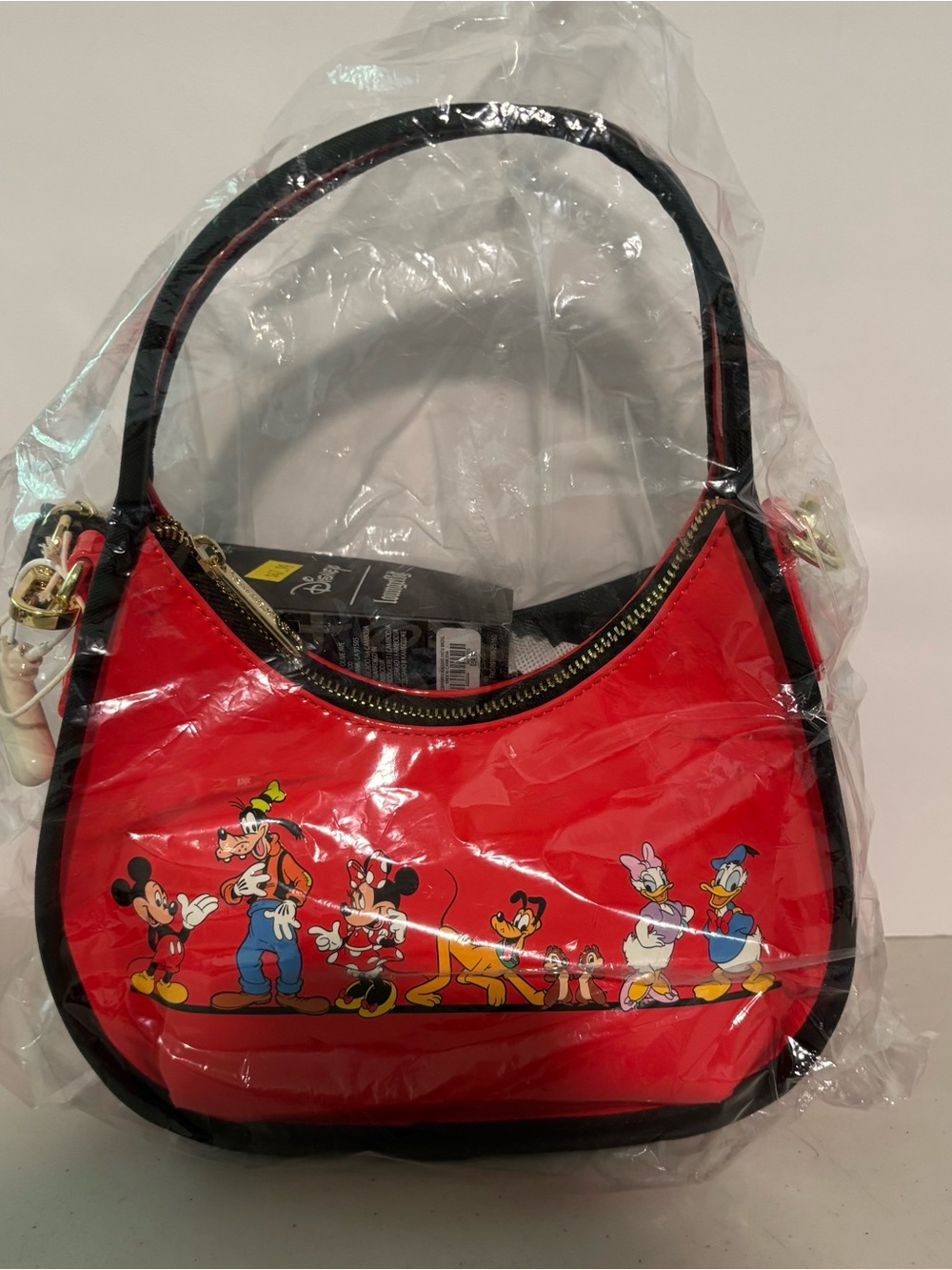 Red Disney Character Crescent Shoulder Bag. Loungfly.